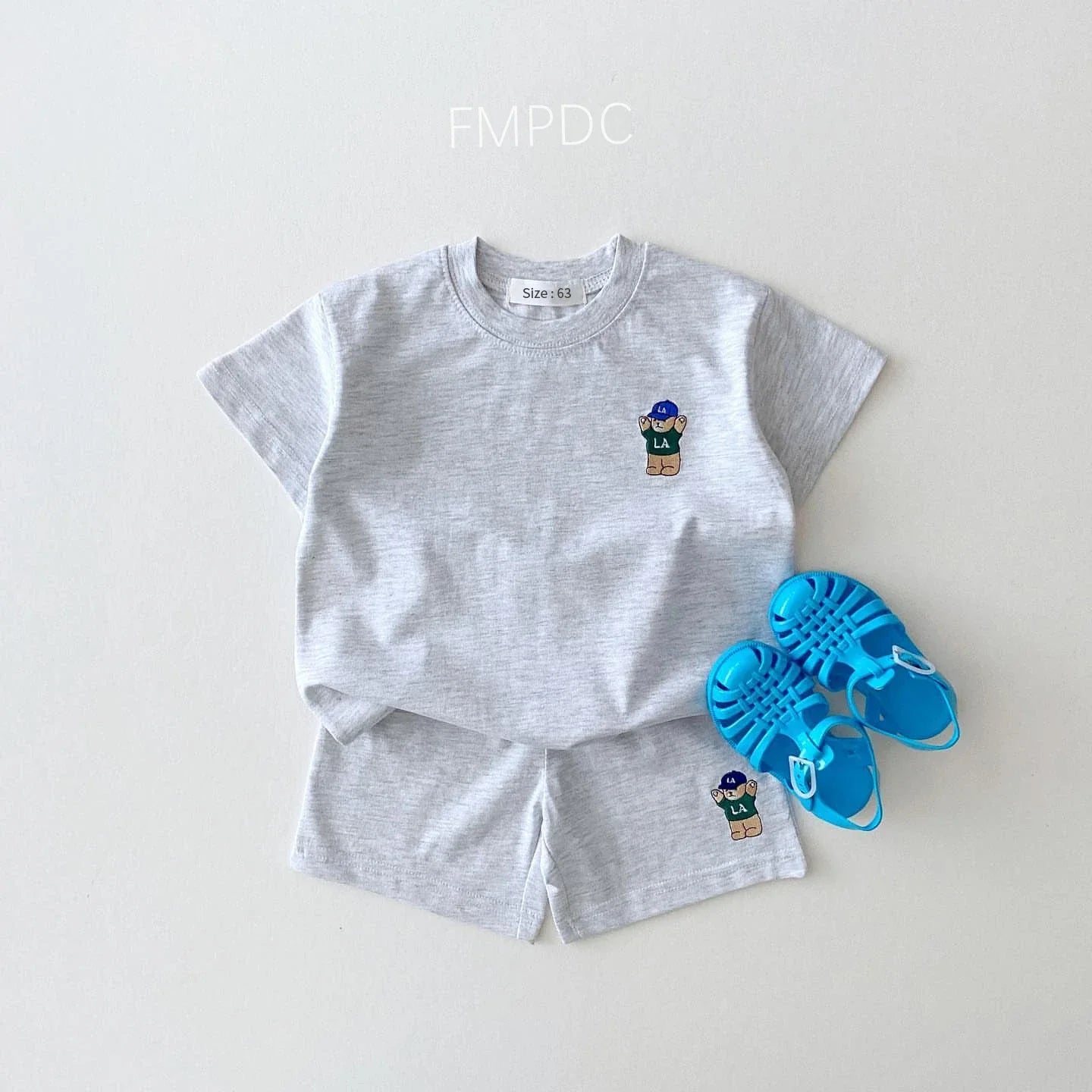 Soft infant t-shirt with charming bear embroidery for baby boys, paired with simple cotton shorts