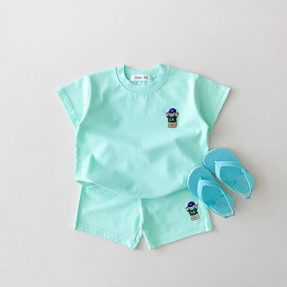 Close-up on the quality stitching of the bear embroidery on the baby boy's cotton blended t-shirt
