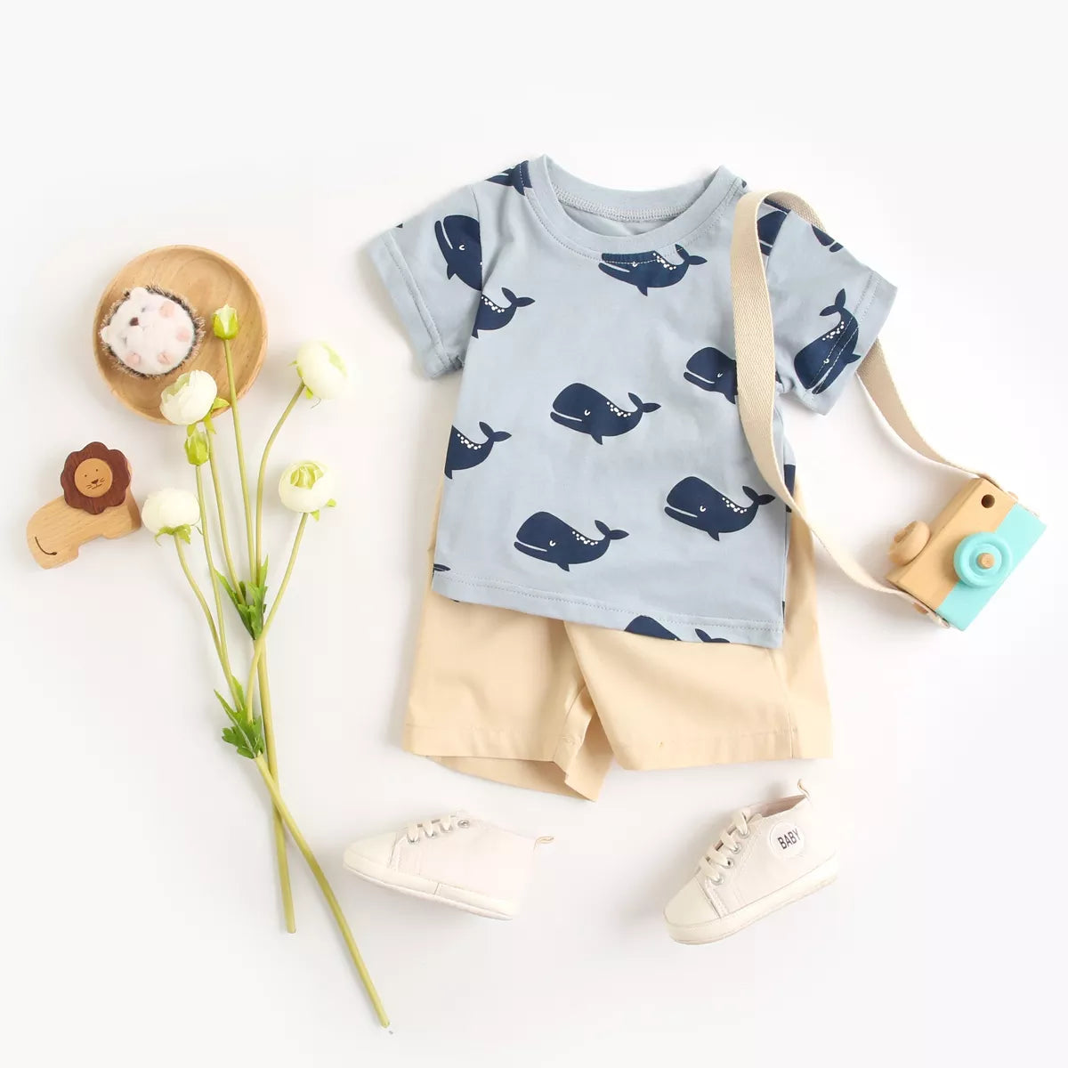 Playful baby boy's cartoon cotton short sleeve shirt and coordinated shorts for comfort.