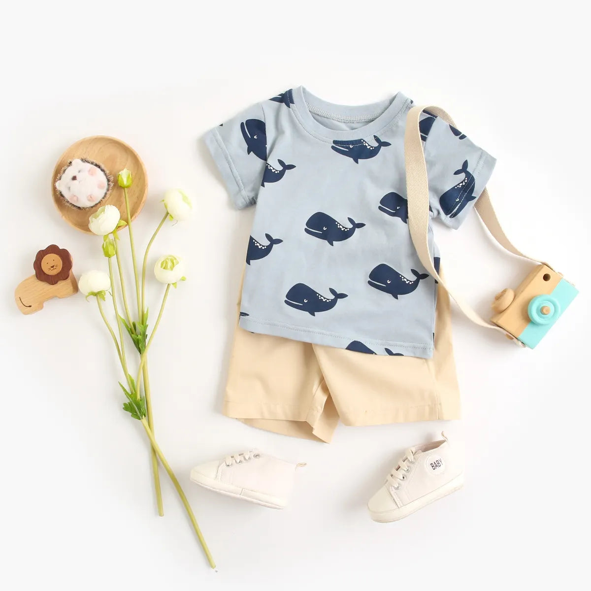 Playtime wear: baby boy's cartoon cotton short sleeve top and shorts set in vibrant colors.