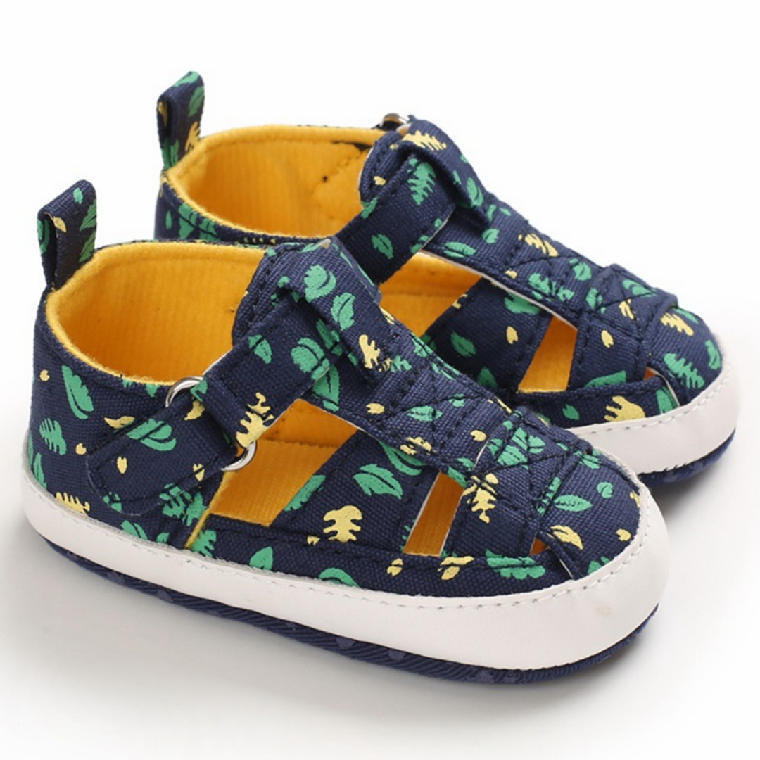 Pair of baby boy's first walker sandals, blue printed canvas, comfortable and safe for new steps