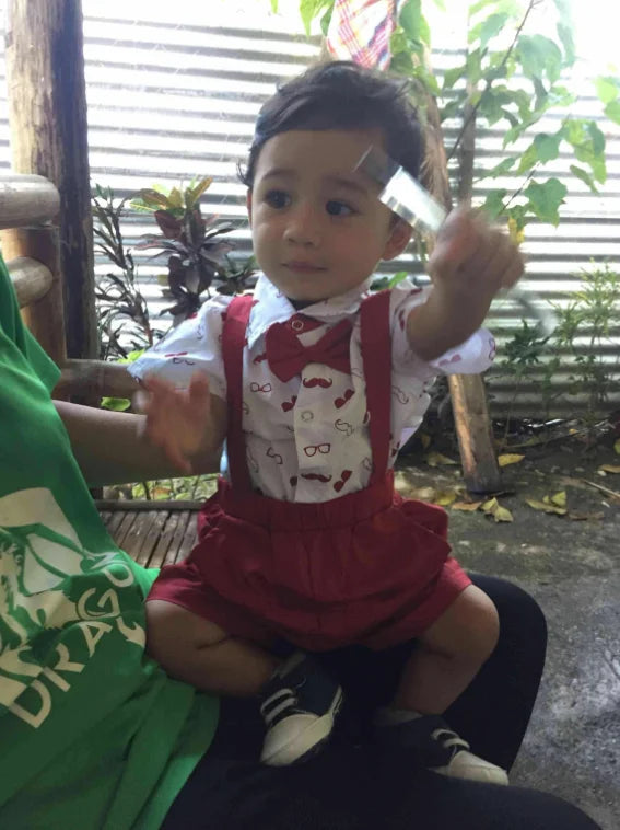 Adorable baby boy gentleman set, including a crisp bow tie bodysuit and coordinating suspender pants