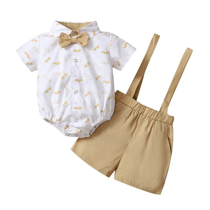 Baby boy party outfit: white bow tie bodysuit and dark blue suspender pants, complete set