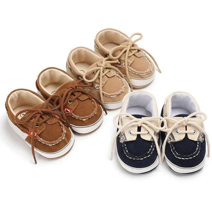Baby boy's soft sole canvas loafer first walker shoes in navy, gentle for infant feet.