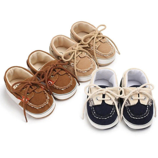 Baby boy's soft sole canvas loafer first walker shoes in navy, gentle for infant feet.