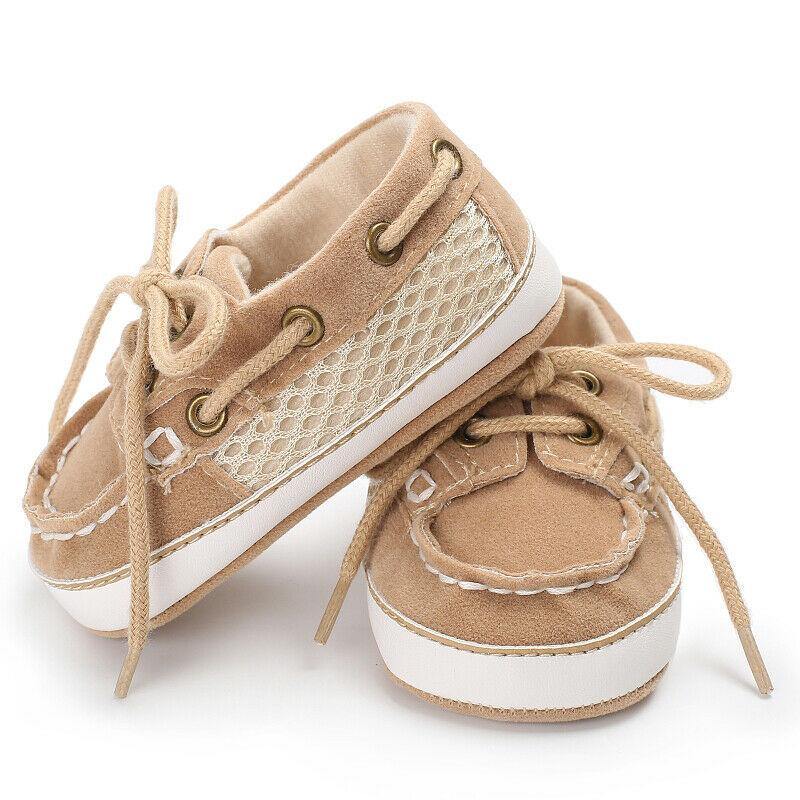 Close-up of a baby boy's soft soled loafer crib shoe, perfect for early steps.