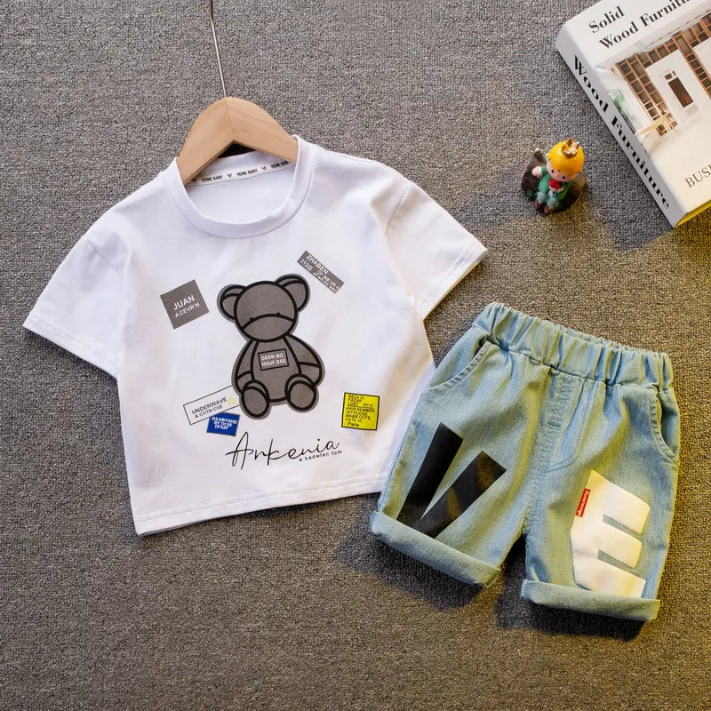 Baby boy's summer fashion outfit; blue short sleeve shirt and striped shorts for toddlers.