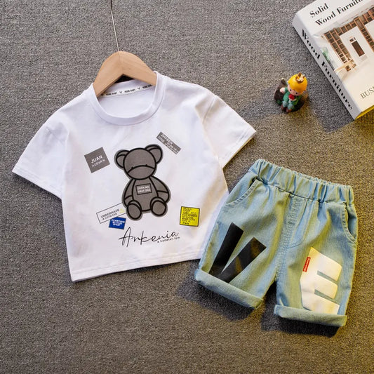 Baby boy's summer fashion outfit; blue short sleeve shirt and striped shorts for toddlers.