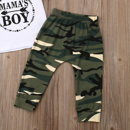Casual baby boy's apparel, a comfortable white shirt and durable camouflage trousers.