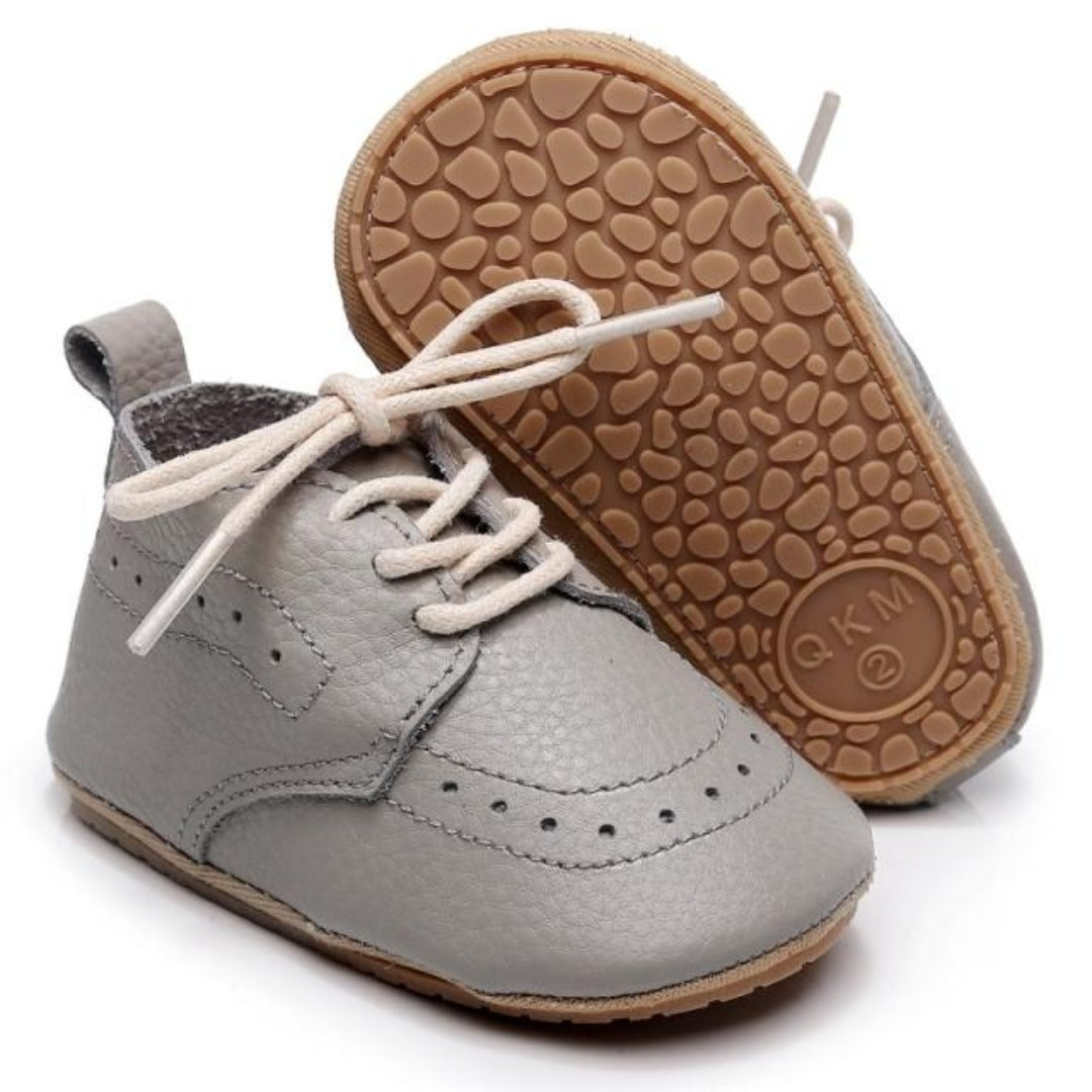 Side view of baby boy leather soft sole shoes, ideal for first steps and everyday wear