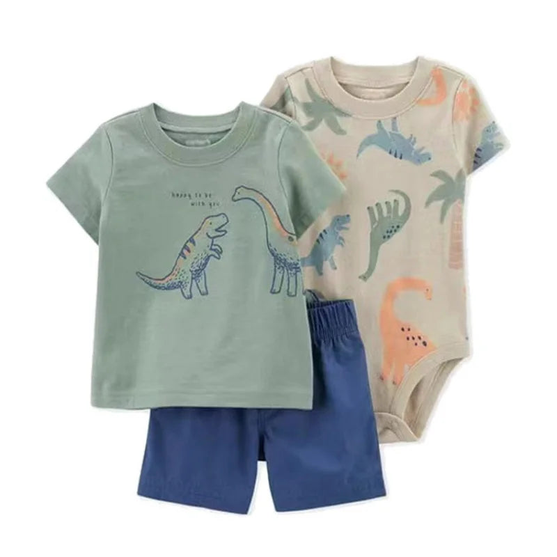 Model wearing baby boy summer outfit: white t-shirt, blue shorts, comfortable cotton set