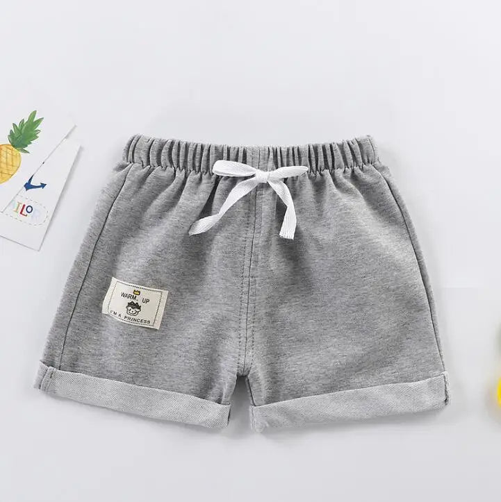 Relaxed fit purple boys' shorts, designed for comfort and durability in children's apparel.