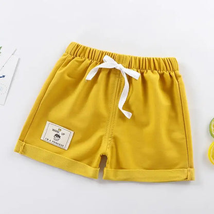 Front view of black solid toddler shorts with an elastic drawstring waist, durable kids fashion.