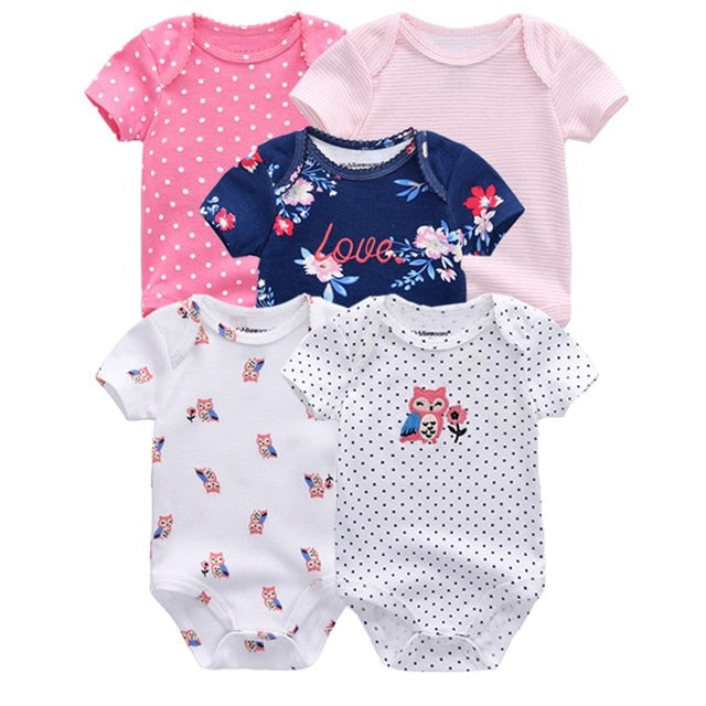 Baby boy wearing a blue patterned short sleeve onesie, showcasing comfortable baby wear.