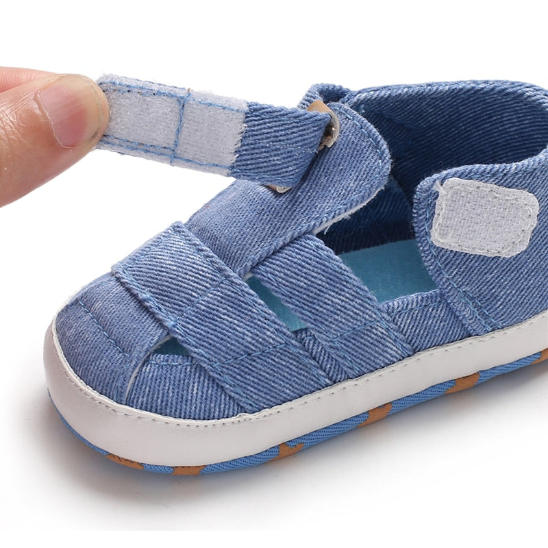 Front view of baby boy's first walker canvas sandals with adjustable strap, anti-slip design