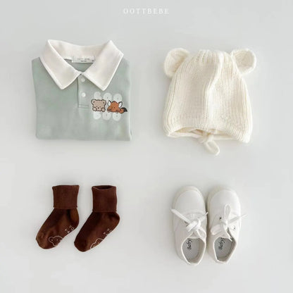 Stylish baby boy long sleeve cotton romper with an all-over classic cartoon pattern.