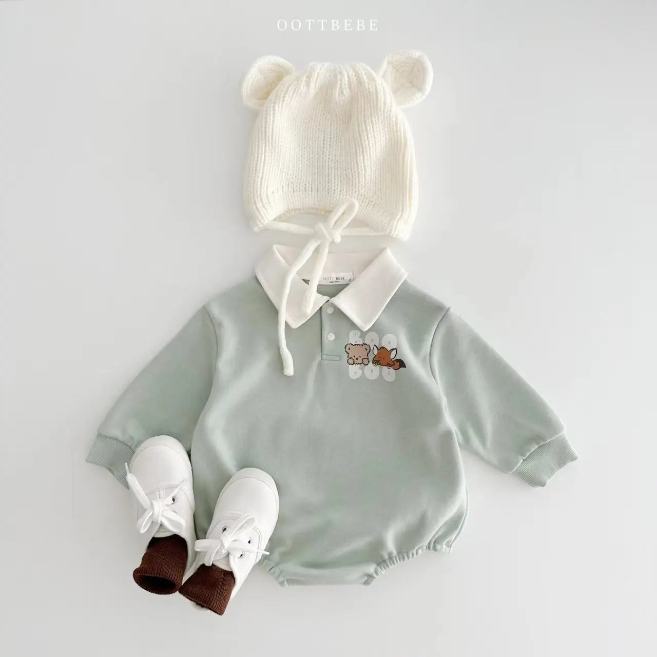 Newborn boy's cotton romper in vibrant colors with adorable cartoon print, ideal for daily wear.