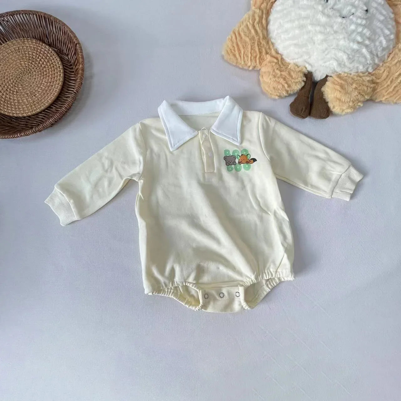 Soft cotton baby boy romper with long sleeves and eye-catching cartoon graphic.
