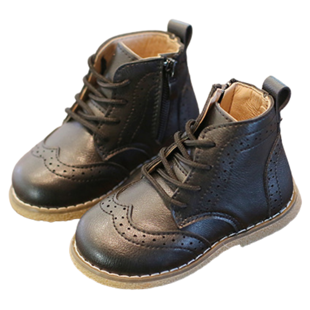 A baby boy wearing brown leather brogue first walker shoes, showcasing the soft sole and anti-slip features.