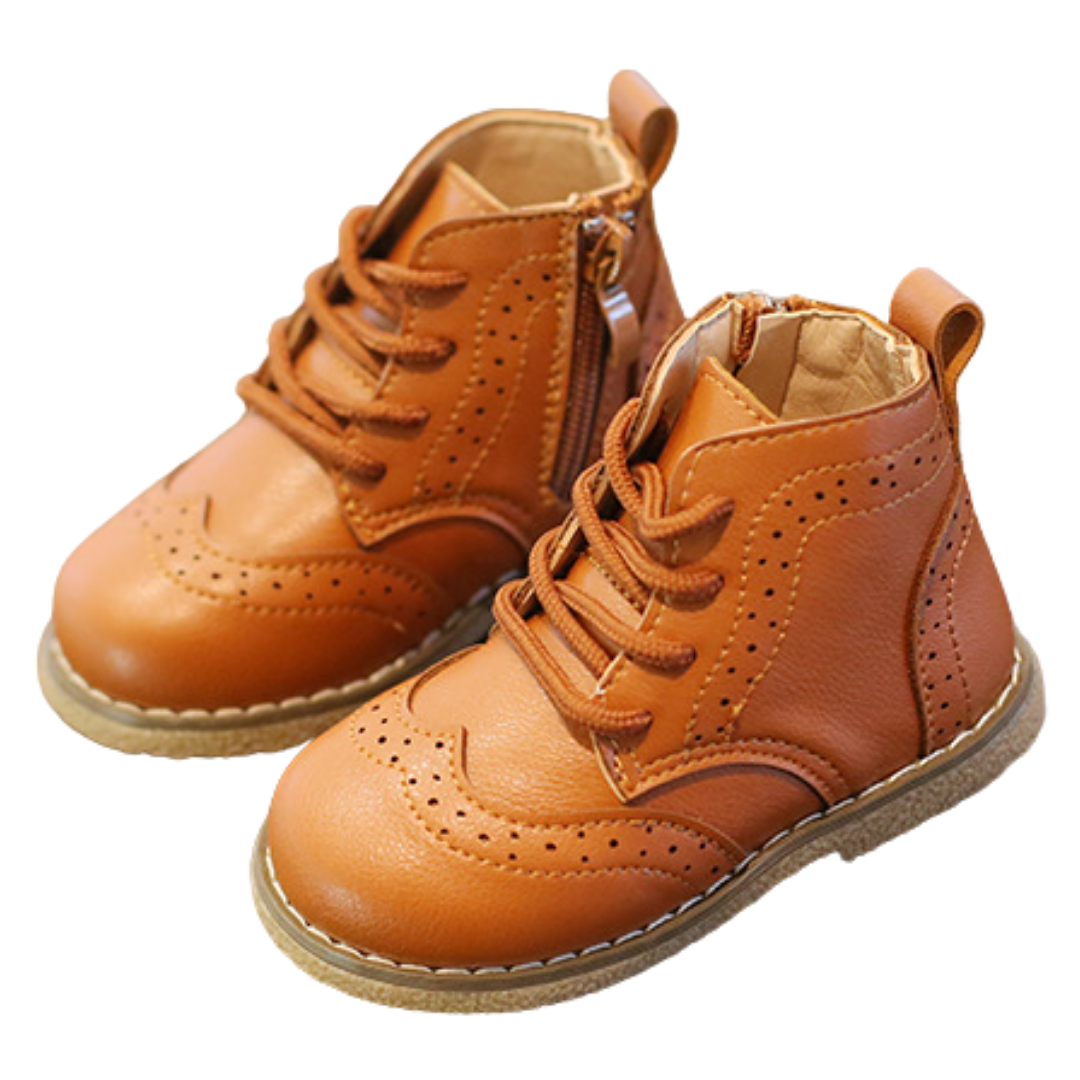 Detailed shot of the soft, flexible sole on a baby boy's leather brogue first walker shoe, perfect for new walkers.