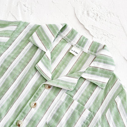 Unisex baby green stripe outfit on a mannequin, showcasing the summer style