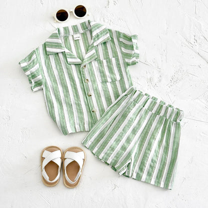 Close-up of green and white striped baby shirt with lapel collar and buttons