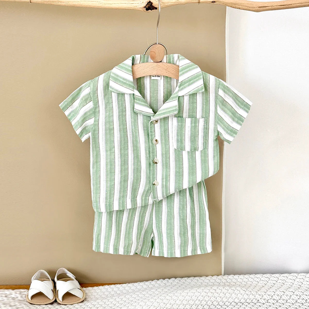 Full view of unisex baby green stripe shirt & shorts set, ideal for warm weather