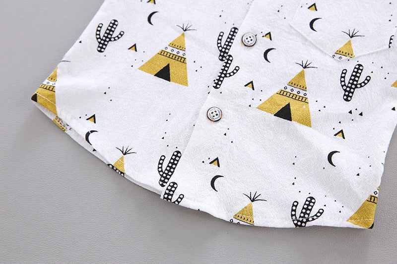 Unisex baby outfit with bold pyramid print short sleeve top and pull-on shorts