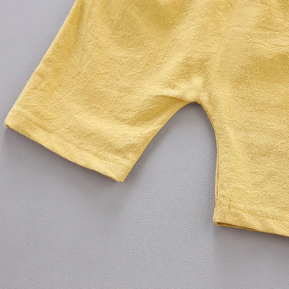 Cotton poplin baby set featuring modern pyramid pattern, short sleeves, and easy dressing