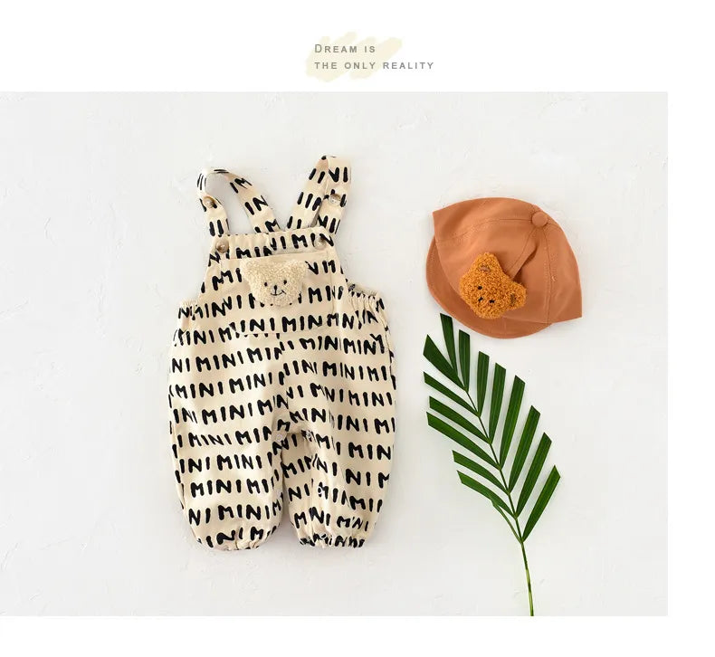 Newborn wearing a grey and white striped romper, comfortable baby spring outfit