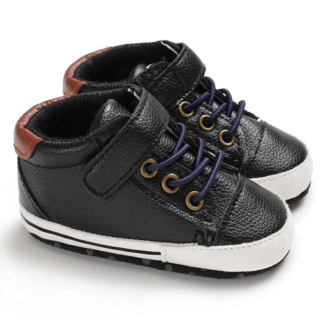 Soft sole baby boys' sneakers in a classic leather style for comfortable first steps.