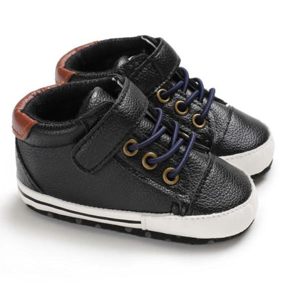 Soft sole baby boys' sneakers in a classic leather style for comfortable first steps.