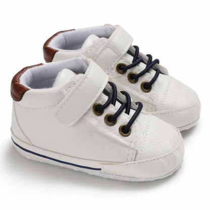Infant boys' first walker footwear, soft sole leather sneakers for growing little feet.