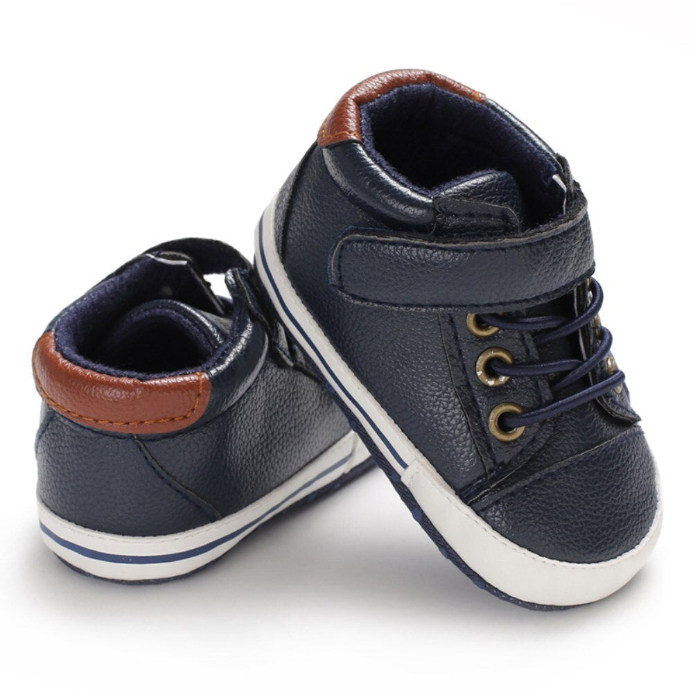 Durable yet comfortable baby boy leather sneakers, perfect first walker soft sole shoes.