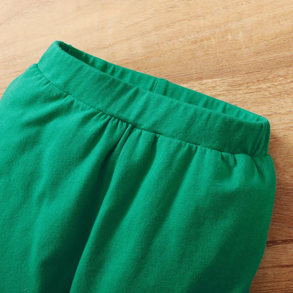Close-up of the elastic waistband on the baby boy’s long pants, part of the sport casual set