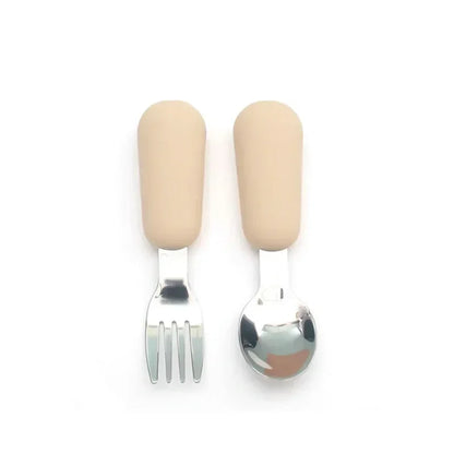 Detailed view of a cartoon animal handle on a stainless steel toddler fork, kids tableware