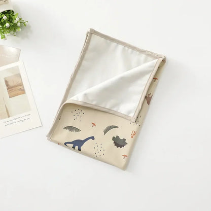 Baby accessory: changing mat with a secure, non-slip backing, easy to clean.