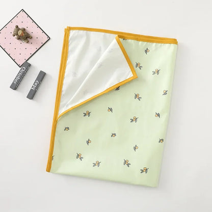 Set of two reusable changing mats for baby, featuring different cute designs.