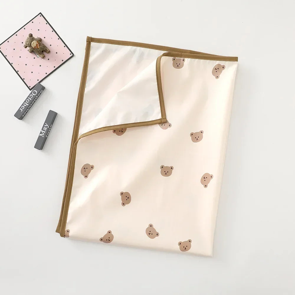 Baby changing mat with a ruler print, useful for tracking baby's growth.