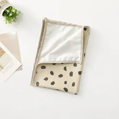 Washable and waterproof baby changing mat, ensuring cleanliness and comfort.