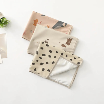 Reusable changing mat for infants, featuring a vibrant, easy-to-clean surface.