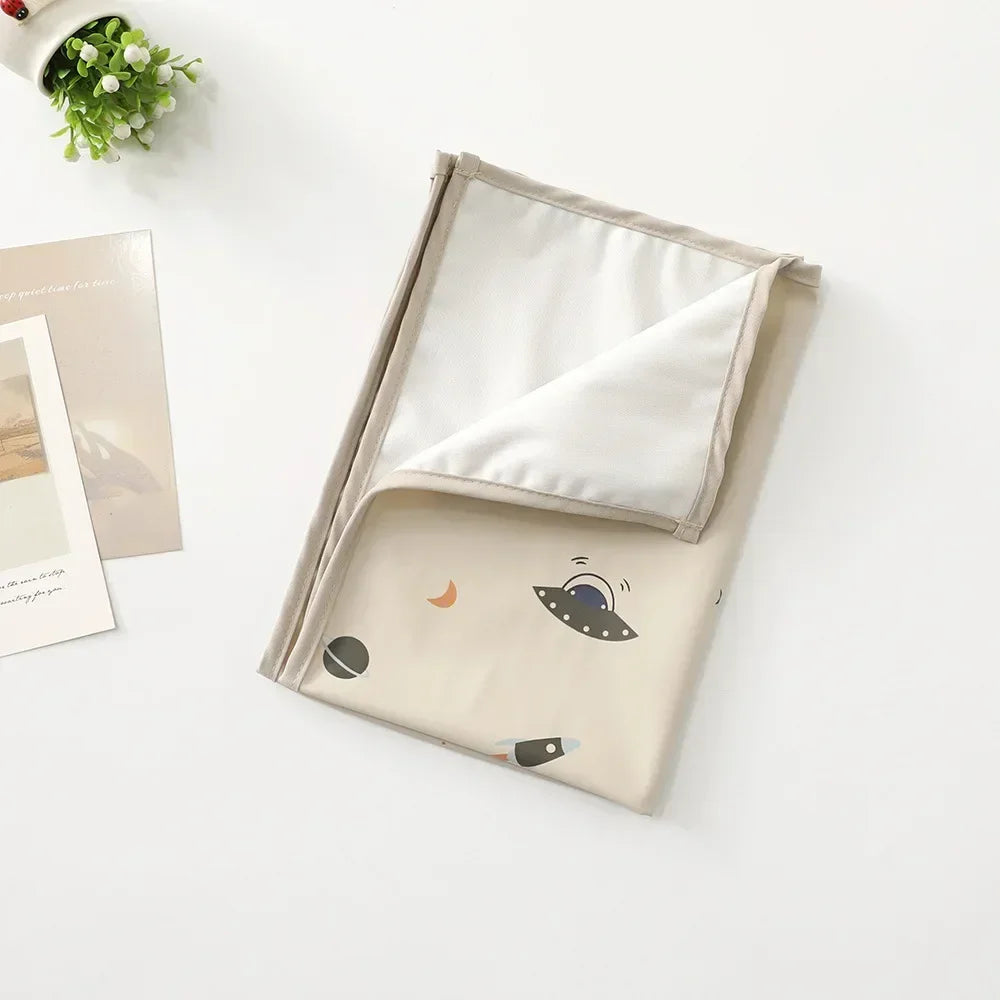 Baby changing mat in use, demonstrating its reusability for diapering.