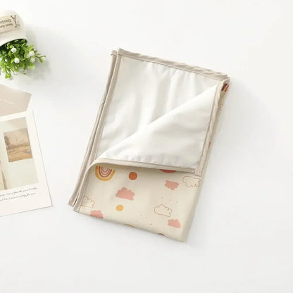 Travel-friendly baby changing mat, compact and waterproof for on-the-go parents.