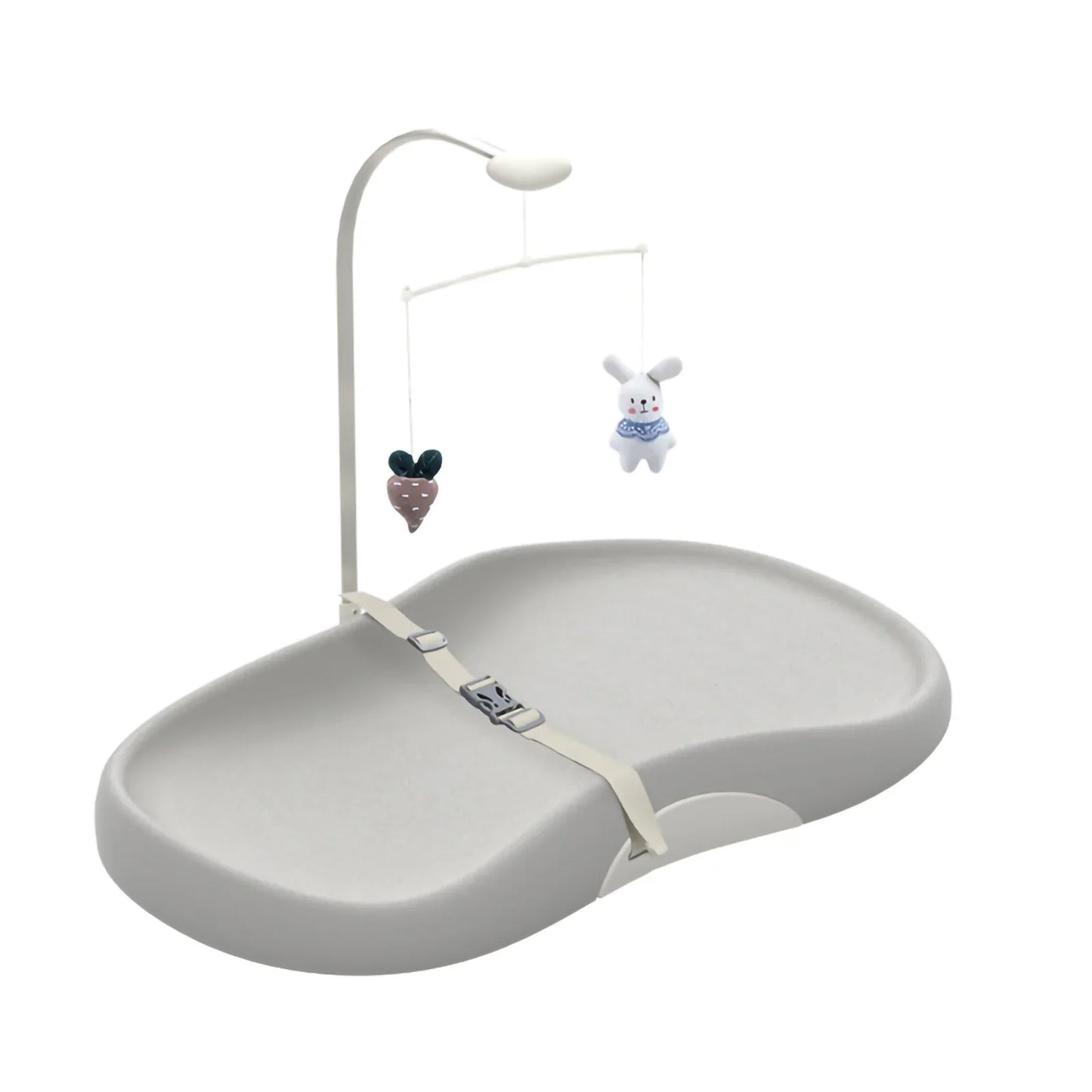 Contoured wipe-clean baby changing pad with safety strap and toy bar for nursery.