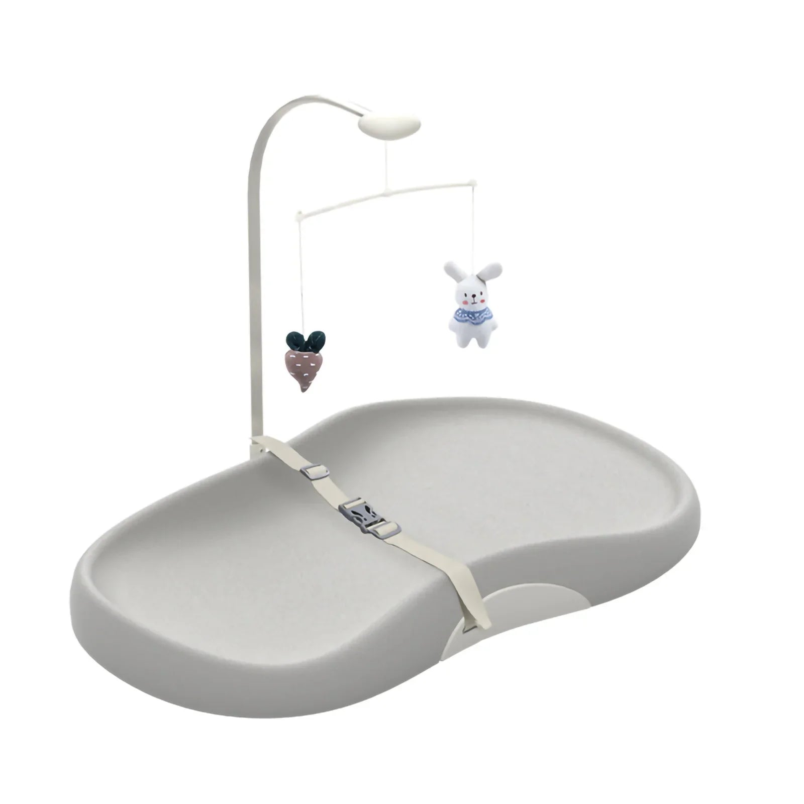 Contoured wipe-clean baby changing pad with safety strap and toy bar for nursery.