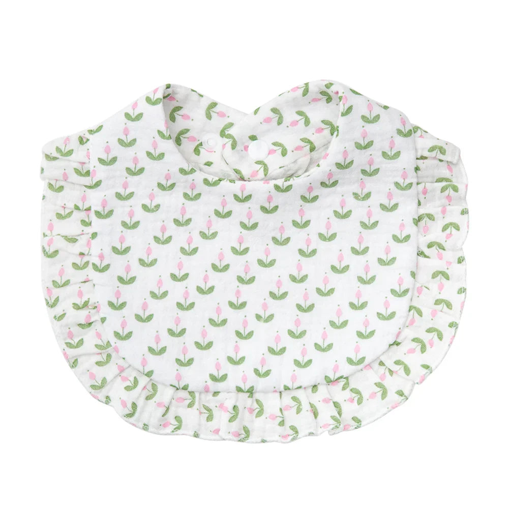 Adjustable snap baby bib in soft cotton, featuring a delightful flower print, for everyday use.