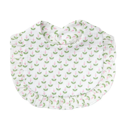 Adjustable snap baby bib in soft cotton, featuring a delightful flower print, for everyday use.