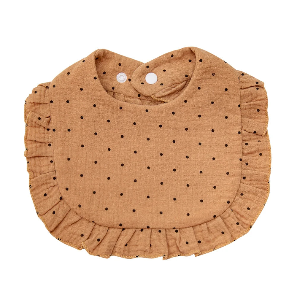 White baby cotton bib with a colorful flower print, designed with an adjustable snap for comfort.
