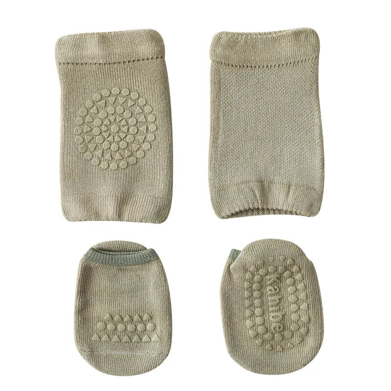 Overhead view of two pairs of baby knee pads and two pairs of anti-slip socks in various colors.