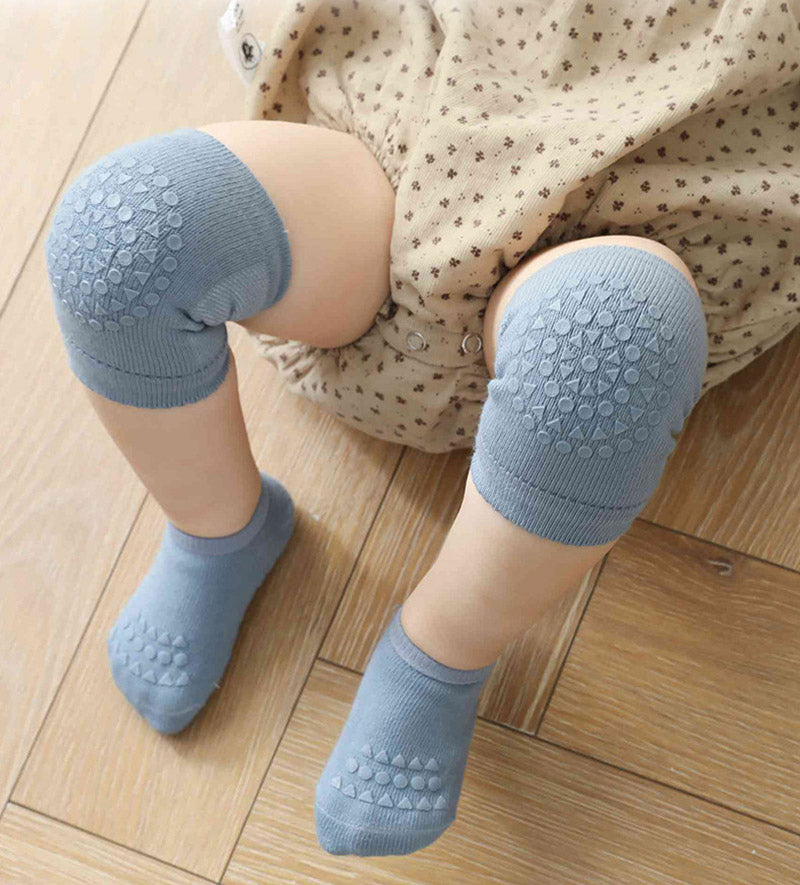 Soft, stretchable baby knee pads with silicone dots and ribbed anti-slip socks for infants.